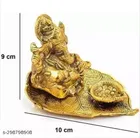 Metal Ganesh Idol Sitting On Leaf 