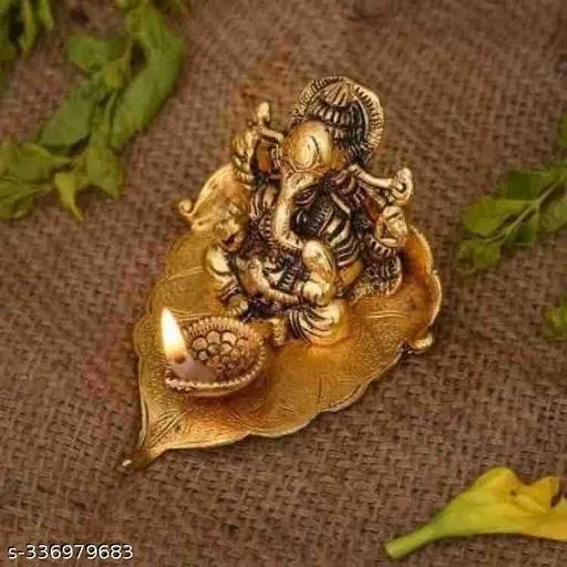 Metal Ganesh Idol Sitting On Leaf (Yellow)