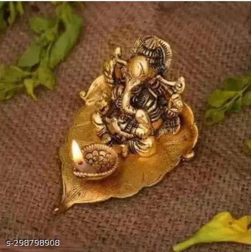 Metal Ganesh Idol Sitting On Leaf (Yellow)