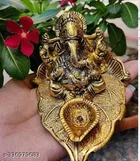 Metal Ganesh Idol Sitting On Leaf 
