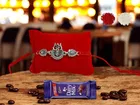 Combo of Metal Rakhi, Greeting Card, Roli  & Chocolate 