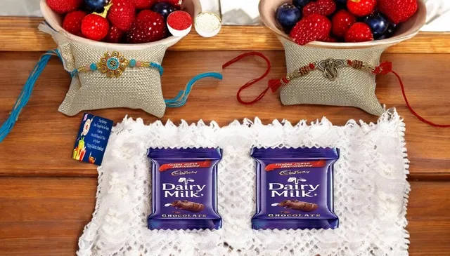 Metal 2 Pcs Rakhi with Greeting card, Roli & 2 Pcs Chocolate (Multicolor, Set of 1)