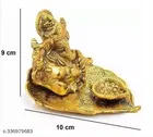 Metal Ganesh Idol Sitting On Leaf 