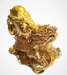 Brass Laughing Buddha Sitting On Dragon Decorative Showpiece 