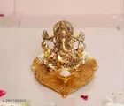 Metal Ganesh Idol Sitting On Leaf 